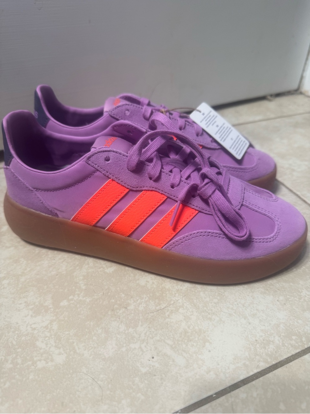 Adidas Purple Sneakers with Bright Orange Stripes